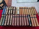 a pile of books sitting on top of a red table