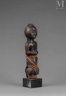 a wooden statue of a man with a rope around his neck