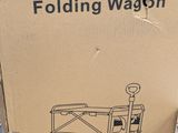 cardboard box with a drawing of a wagon on it sitting on a pallet