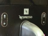 a close up of a coffee machine with buttons on it