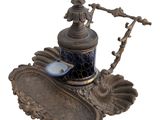 an image of a teapot with a spoon on it