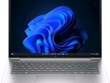 une image représentant un ordinateur portable posé sur une surface blanche, sur fond bleu