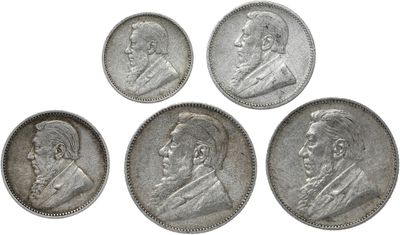six different types of silver coins on a white background