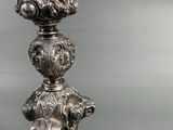silver plated candle holder with a statue of a woman and a dog