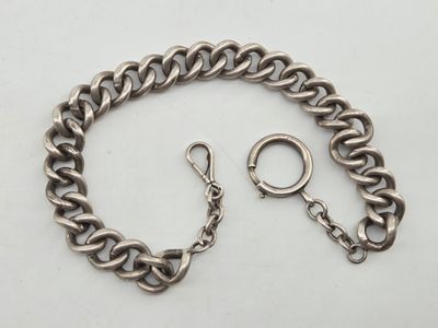 a close up of a chain bracelet with a ring on it