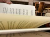a person reading a book in a library