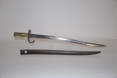 a knife that is laying on a table