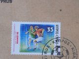 a stamp with a picture of a soccer player on it