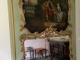 a large mirror in the corner of a room