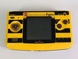 a yellow and black game console sitting on a white surface