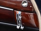 a close up of a car door handle with a rope