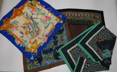 several pieces of cloth are laid out on a white surface