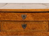 a small wooden box with two drawers on top of it