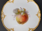 a plate with a picture of an apple on it