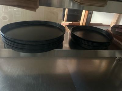 a lot of plates that are sitting on the counter