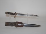 two different types of knives on display on a table