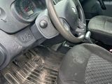 a dirty car with a steering wheel and a dashboard