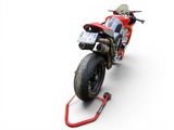 a red motorcycle that is parked on a red stand