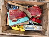 a wooden box filled with assorted items on a table