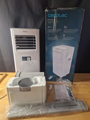 a box with a white air conditioner sitting on a table