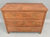 a wooden chest of drawers with brass pulls on each drawer