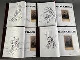 six books of black hills with drawings of people on them