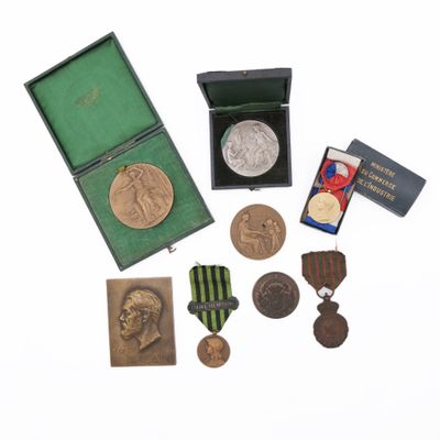 an image of a collection of medals including a medal, a medal, a medal, a medal, a medal, and a medal