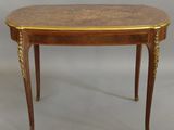 an image of a small table with a wooden top and gold decoration