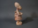 figurine of a woman holding a baby in her arms