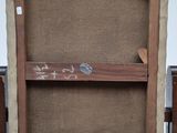 painting of a wooden easel with a piece of paper on top of it