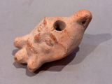 a small clay object that looks like a bird