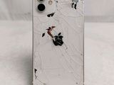 a broken iphone that is sitting on a table