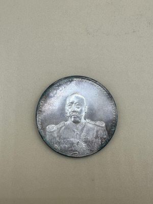 an image of a silver coin with a picture of a man on it
