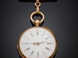 une image représentant une montre de poche en or sur fond noir