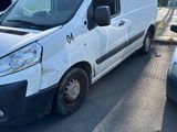 a white van that is parked in a parking lot