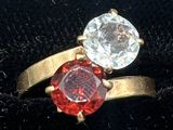a ring with two different colored stones on it