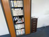 a room with a bookcase and a desk in it