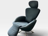 a black leather recliner chair with a footstop and foot rest