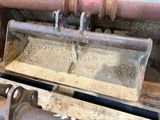 a close up of a machine that is working on a piece of wood