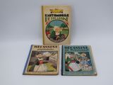 trois livres pour enfants sont posés sur une surface blanche