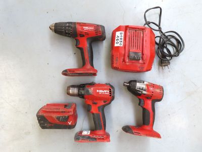 four tools are sitting on a table next to a corded cord