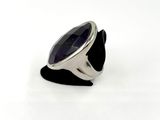 an image of a silver ring with a black stone on it