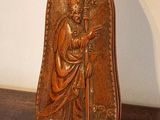 a wooden plaque with a picture of jesus on it
