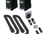 pair of black speakers with remote controls and mountings on a white background
