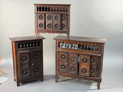 three pieces of furniture are sitting on a gray surface