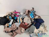 a pile of purses and other items on the floor