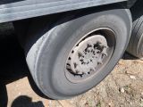 a truck with a flat tire that has been left on the ground