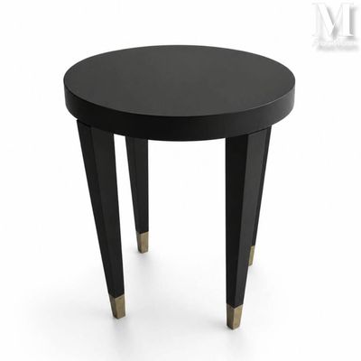 a black table with gold legs on a white background