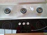 a picture of a stove top with three burners on it
