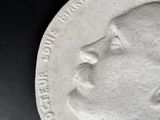 a close up of a medal on a black surface